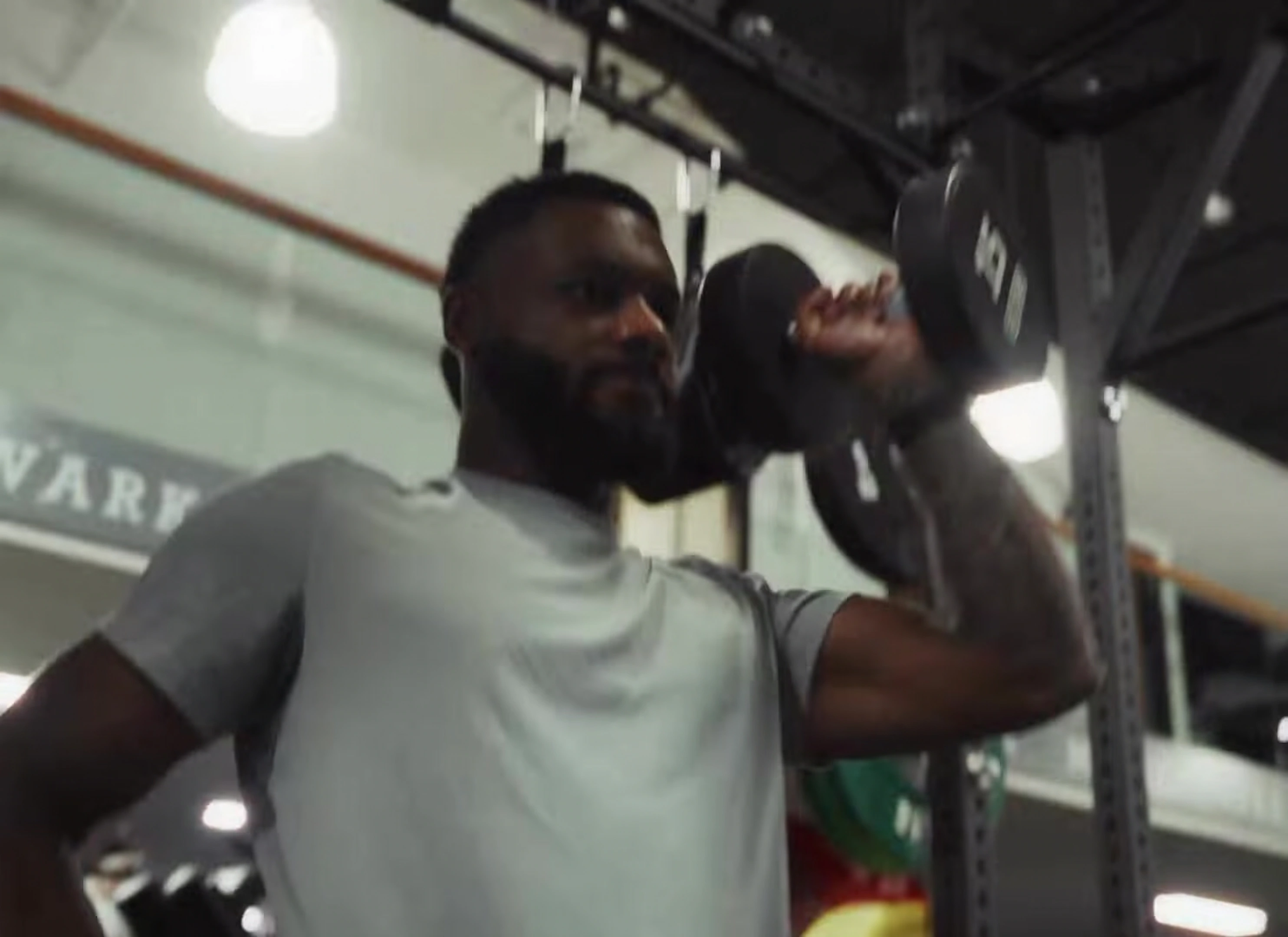 Sam Graham performing a dumbbell shoulder press
